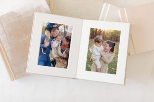 open heirloom photo album displaying family portraits